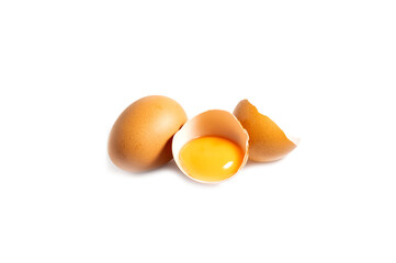 Chicken eggs and half broken egg with yolk isolated on white background.Food concept.