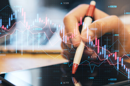 Close up of hand using tablet with pen and abstract downward forex chart on blurry background. Crisis and collapse concept. Double exposure.