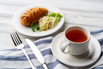 Traditional Russian pie or patty on white plate