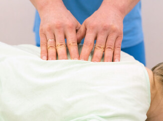 Batumi, Georgia - March 20, 2022: masseur osteopath performs a procedure