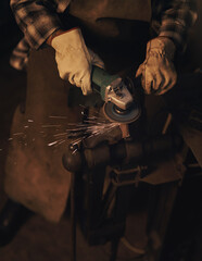 Keep your skills as sharp as your blades. Shot of a woman using an angle grinder while working at a foundry.