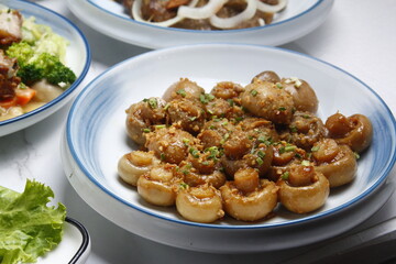 Freshly cooked buttered garlic mushroom