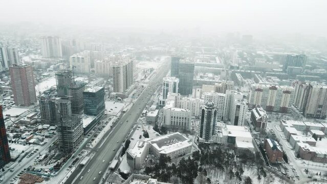 Blizzard morning in the Siberian city. The cityscape is filmed for aerial photography.