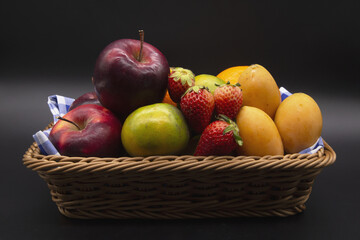 Basket with many kinds of fruits, apples, maprangs, strawberries, oranges,Include Clipping Path.