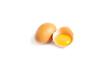 Chicken eggs and half broken egg with yolk isolated on white background.Food concept.