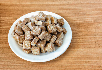 brown sugar cubes in a plate on the table