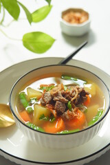 a bowl of beef and vegetables soup 