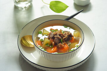 a bowl of beef and vegetables soup 