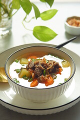 a bowl of beef and vegetables soup 