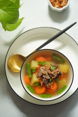 a bowl of beef and vegetables soup 