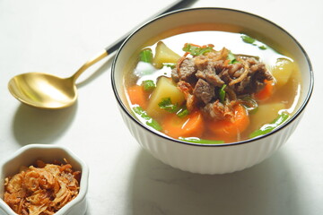 a bowl of beef and vegetables soup 