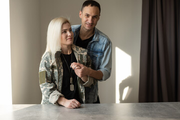 Husband Welcoming Wife Home On Army Leave