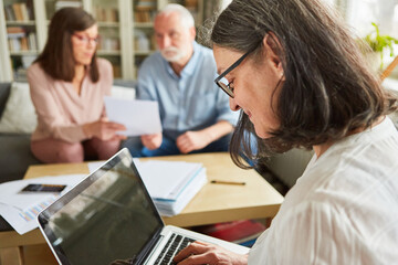 Social worker or tax consultant at the laptop computer