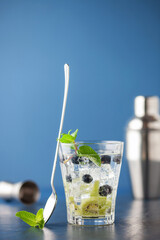 Summer refreshing drink with kiwi, blueberries and ice. Detox water