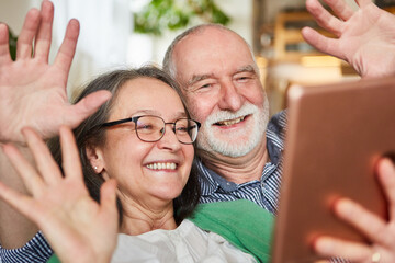 Retired senior couple video chatting