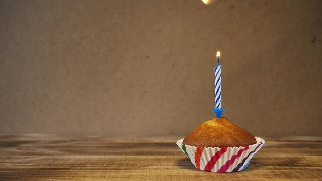 Cupcake and candle - happy birthday idea.concept for congratulations on holidays.Copy space.place for text.