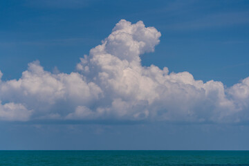 Naklejka na ściany i meble Blue sky, white cloud and calm sea water, sunny day