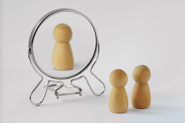 Couple of pawns looking in the mirror with just one of them reflected in it - Concept of egoism and narcissist - 494174452
