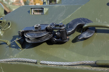 Enlarged fragment and texture of military armored vehicles. Large iron black hook with a winch...