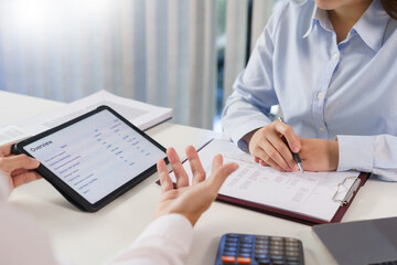 Business concept, Business colleague explain financial data to partner while talking about project