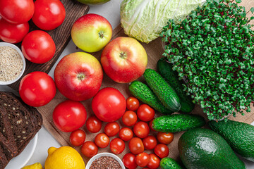 A set of products: fresh vegetables, fruits, bread, herbs and seeds.