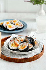 Steamed White Rice (Bap) and Various other Ingredients, Such As Kyuri, Carrot, Sausage, Crab Stick, or Kimchi and Wrapped with Seaweed Laver.