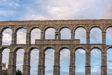 The famous Roman aqueduct of Segovia in Spain. Heritage of humanity by unesco. stone for the construction of a road