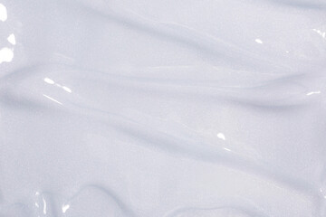 Body of face cream with shiny particles texture. Beauty product swatch with glitter.