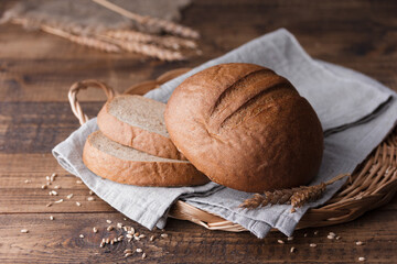 bread and wheat on wooden table