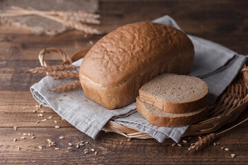 bread and wheat on wooden table