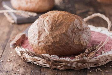 bread and wheat on wooden table
