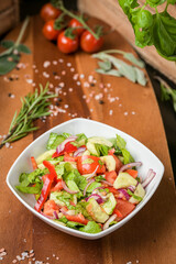 Fresh spring salad dish ready to be served. Healthy side food. Food photography.