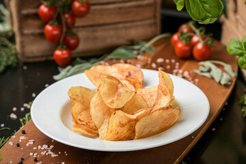 A dish with chips fries ready to be served. One of the most popular snack side food in the world. Food photography.