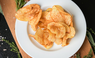 A dish with chips fries ready to be served. One of the most popular snack side food in the world. Food photography.