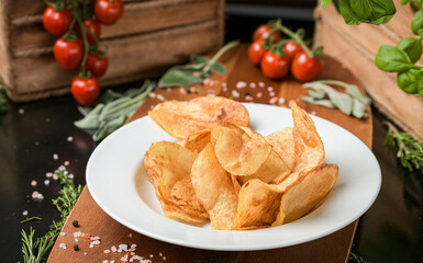 A dish with chips fries ready to be served. One of the most popular snack side food in the world. Food photography.