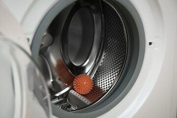 Dryer ball in washing machine drum, closeup