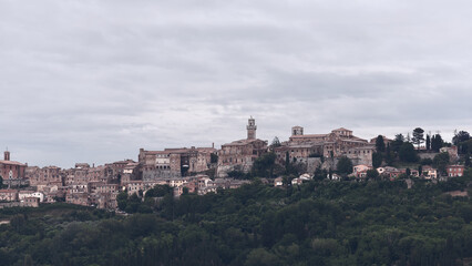 Fototapeta na wymiar Panoramic view to the western side of historic Montepulciano town on the hill, Siena, Italy