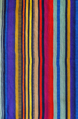 High quality texture of a multicolor vertical striped fabric in Mexican style.