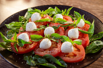 tomatoes marinated in garlic sauce and spices with mozzarella cheese