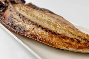 Grilled mackerel on a white background
