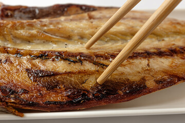 Grilled mackerel on a white background