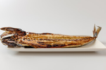 Grilled mackerel on a white background