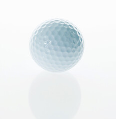 Single golf ball isolated on white background