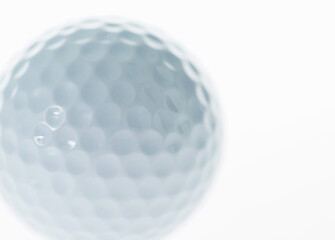 Macro shot of golf ball isolated on white background