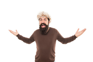 surprised brutal hipster with beard in earflape hat isolated on white background, fashion