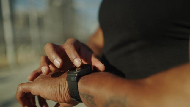 black man running and excercising sportspark sunset fitness slowmotion smart watch