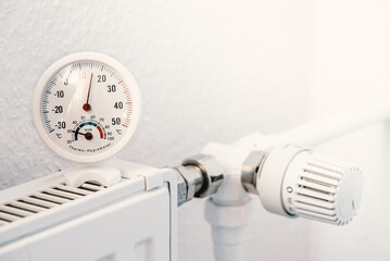turn off home heating radiator and a thermometer showing 16 degrees Celsius, energy crisis in Europe