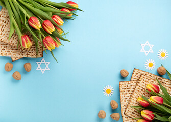Passover greeting card with matzah, nuts daisy and tulip flowers on blue background.