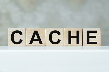 Cache Word Written In Wooden Cubes On White Table Isolated