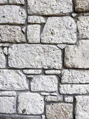 Stone wall texture. Part of old rocky hand crafted background with copy space. Walls made of natural bricks. High quality photo. Home and office design backdrop